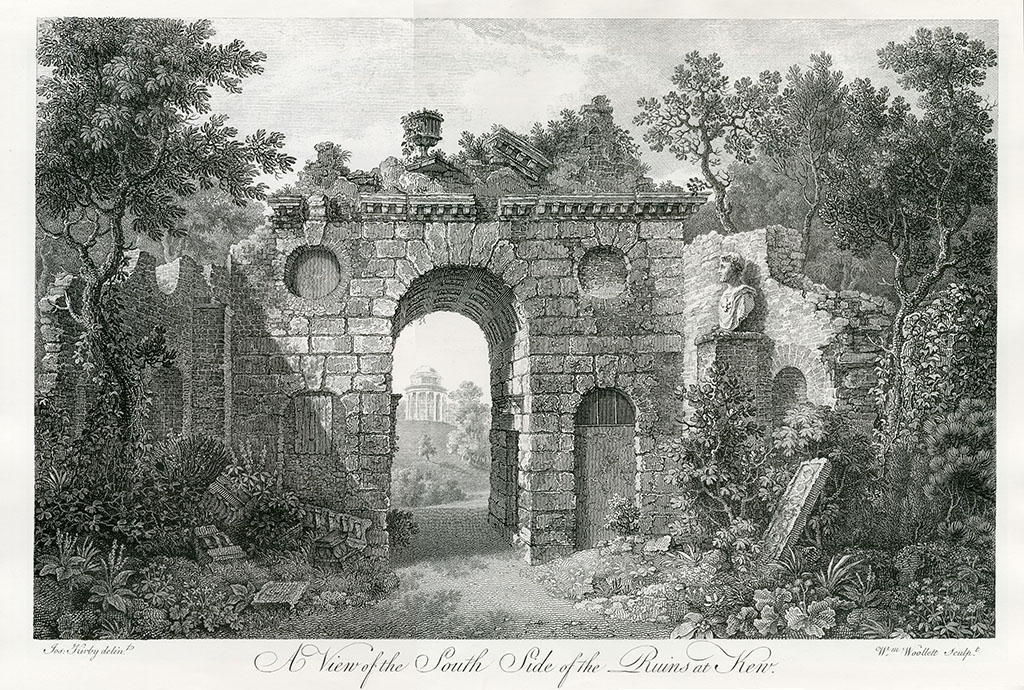 An arch in a ruined stone wall, through which a small columned temple can be seen