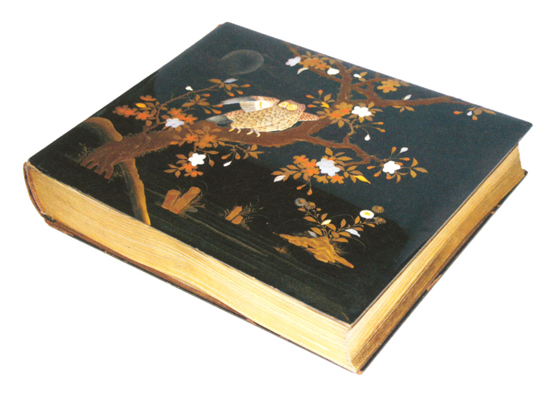 Lacquered book featuring an owl perched on a flowered branch