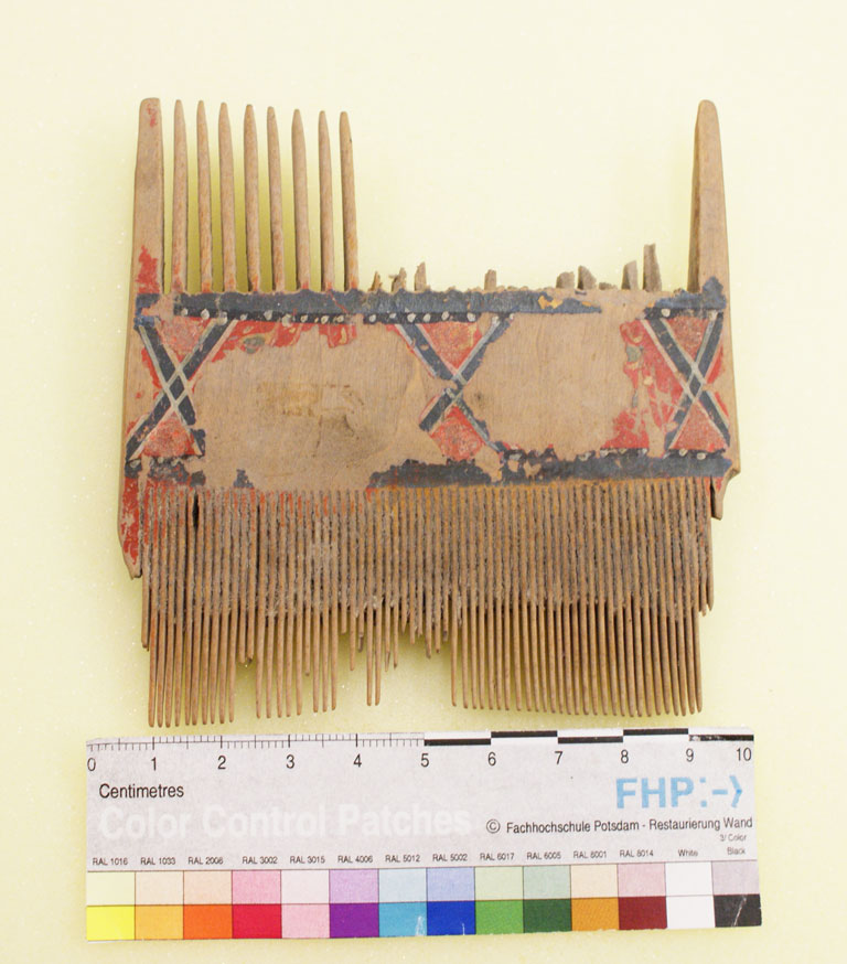 Wooden comb, painted red and black