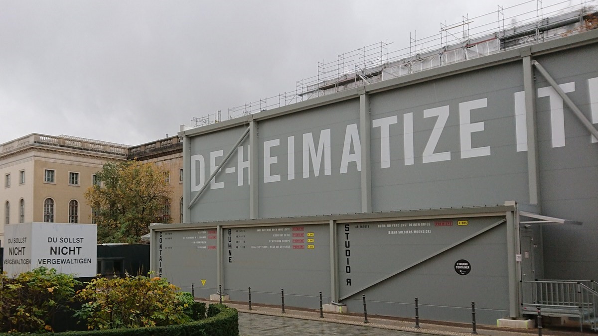 Theater container with DEHEIMATIZE IT! painted on the side